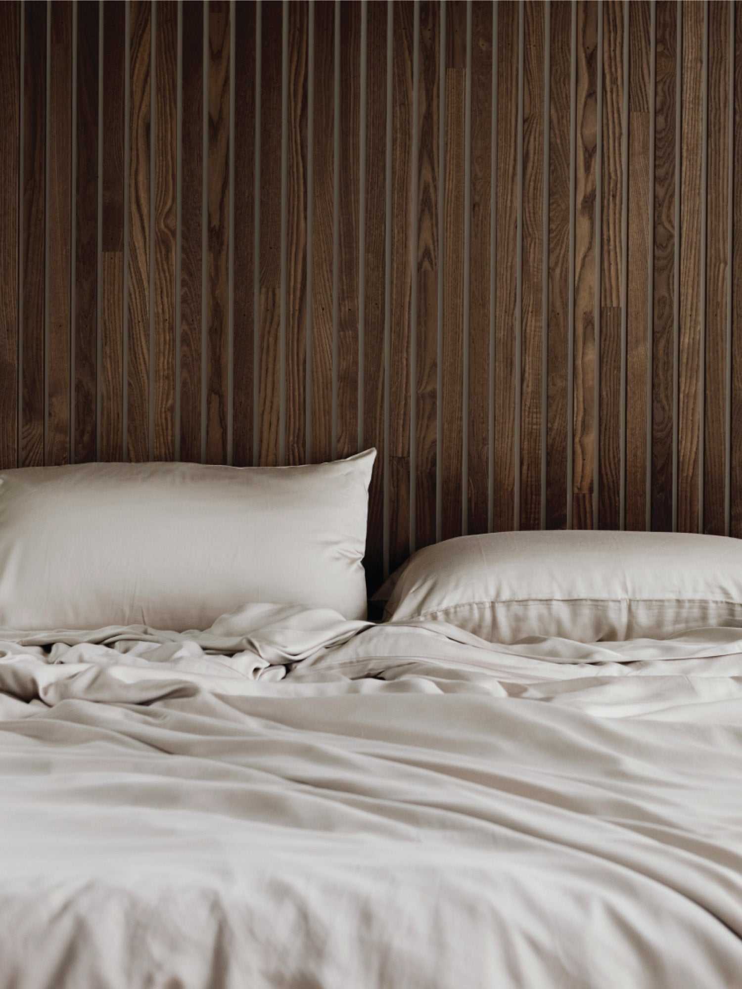 Driftwood pillows and duvet cover on an unmade bed |Color:Driftwood