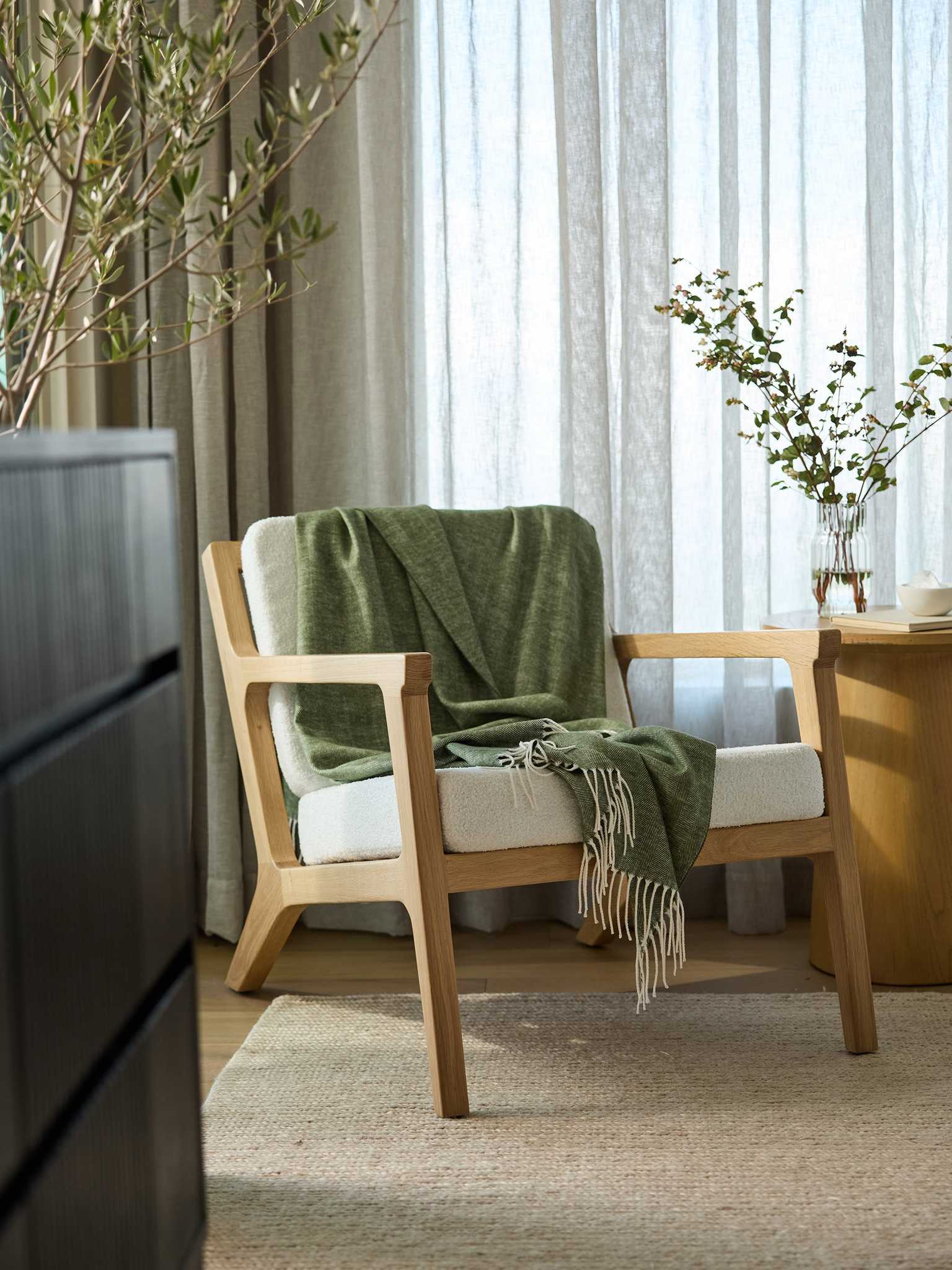 Ivy herringbone tassel throw draped over accent chair |Color:Ivy