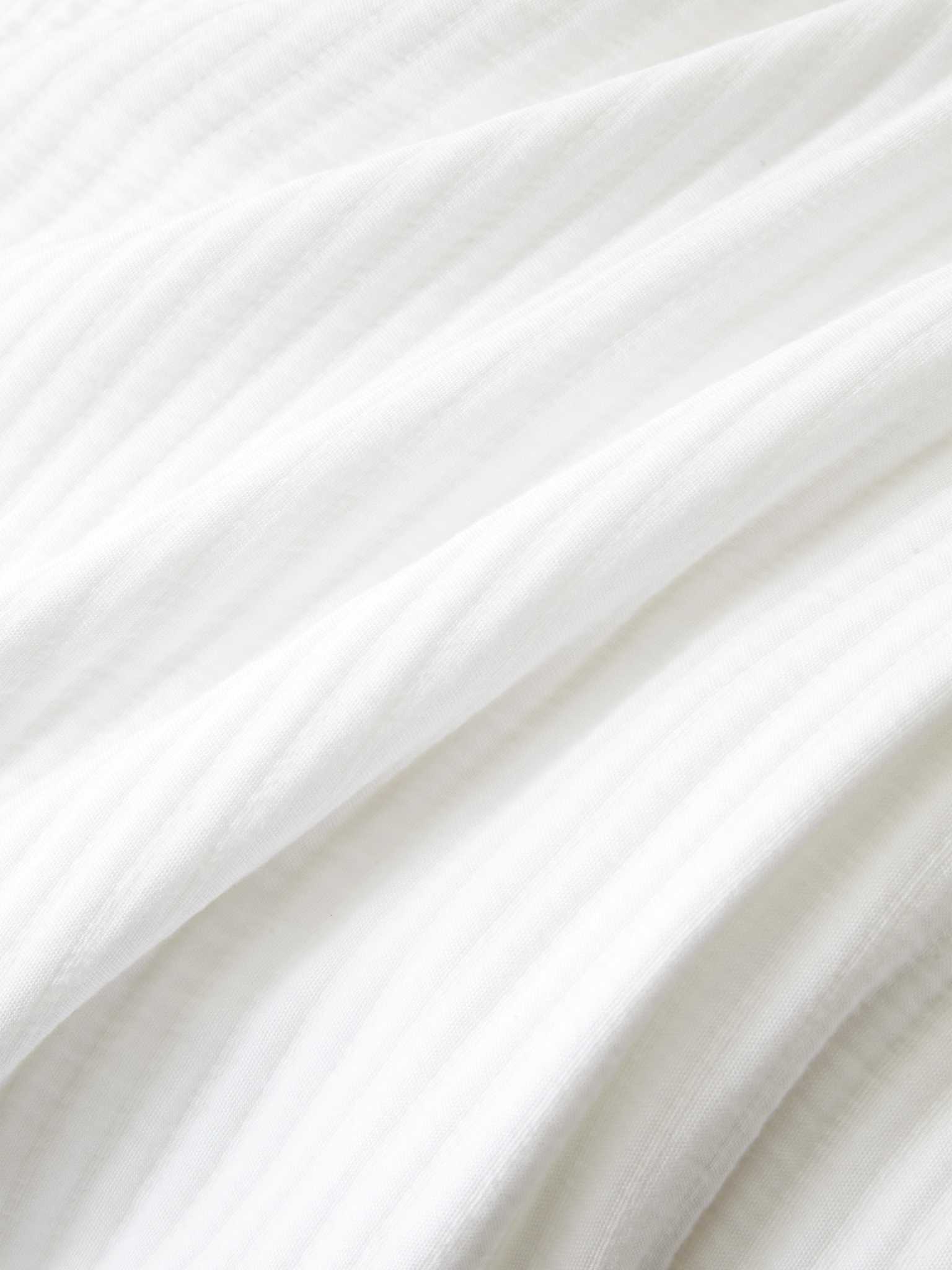 Close up of white coverlet fabric |Color:White