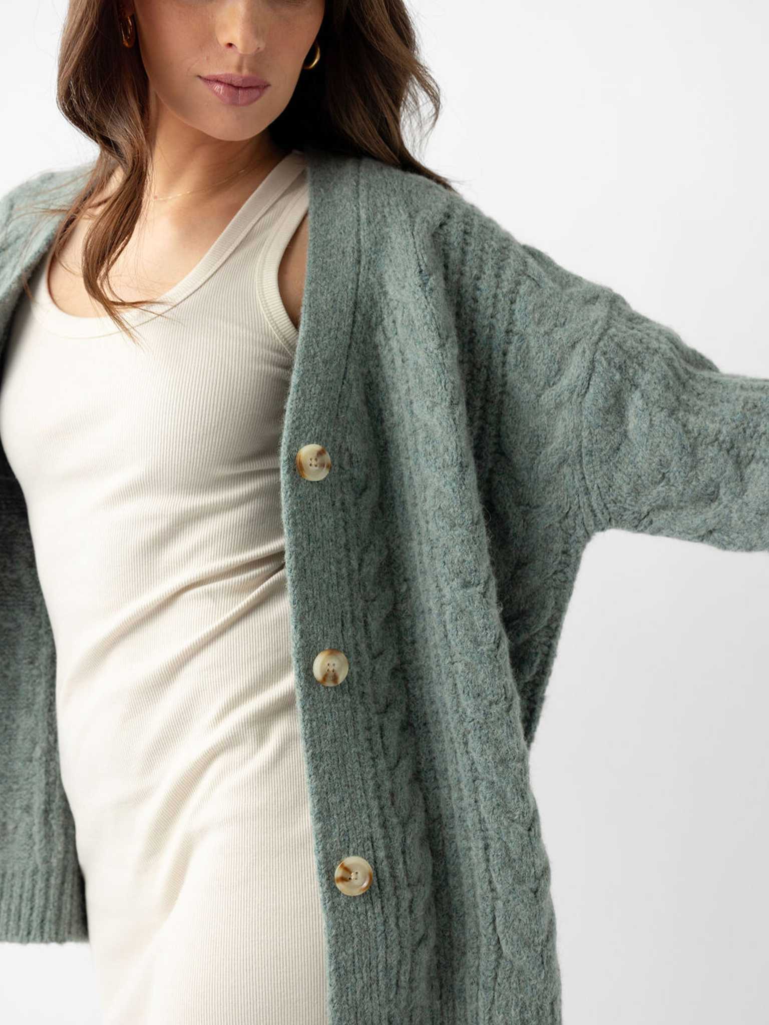 Close up of woman wearing thyme cardigan over off-white dress |Color:Thyme