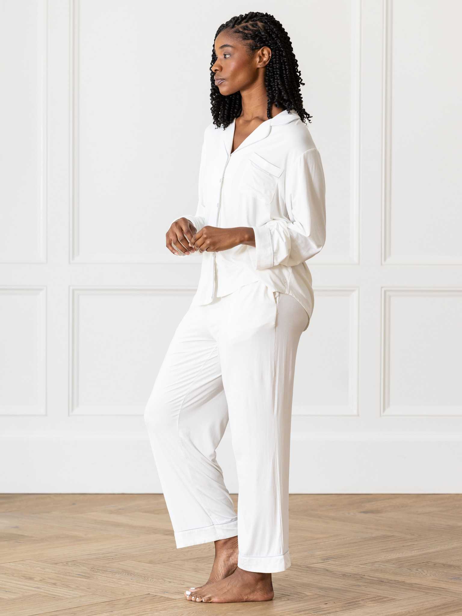 Side view of woman in Ivory PJ set in front of white wall |Color:Ivory