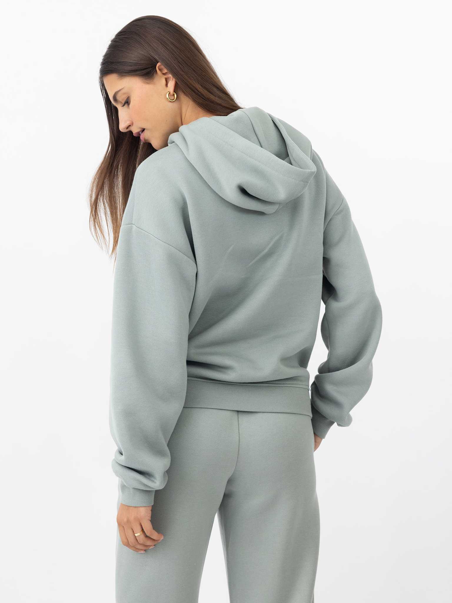 Back of woman wearing haze cityscape hoodie with white background |Color:Haze