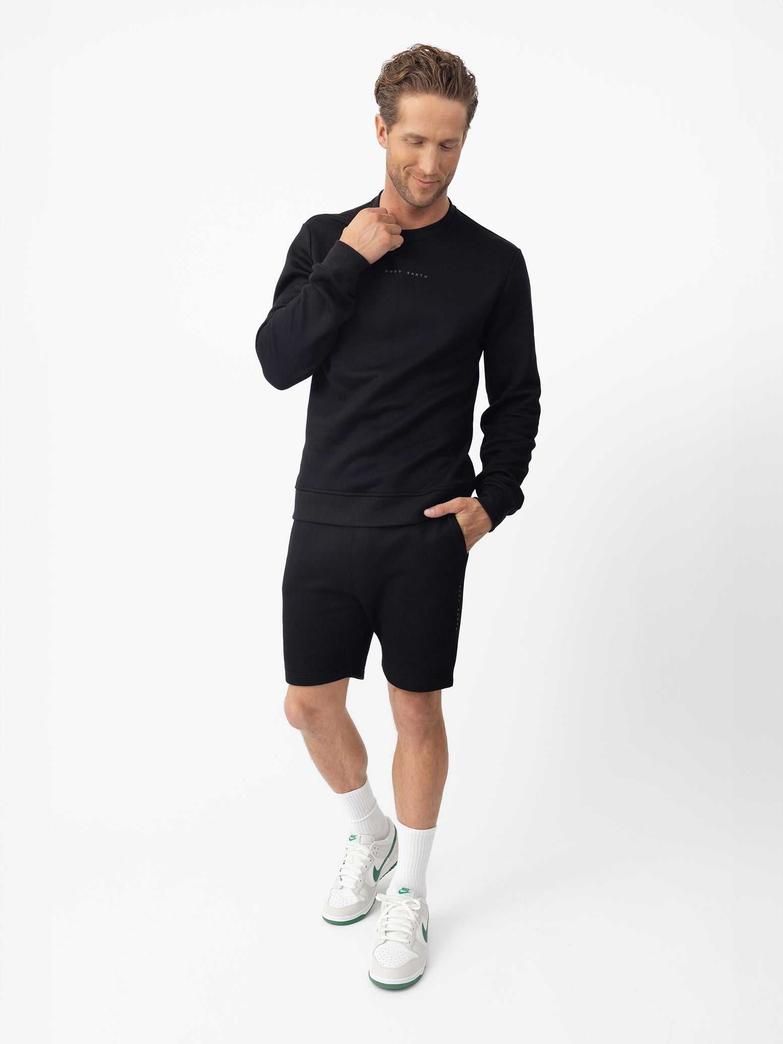 Man wearing black cityscape pullover and shorts with white background |Color:Black