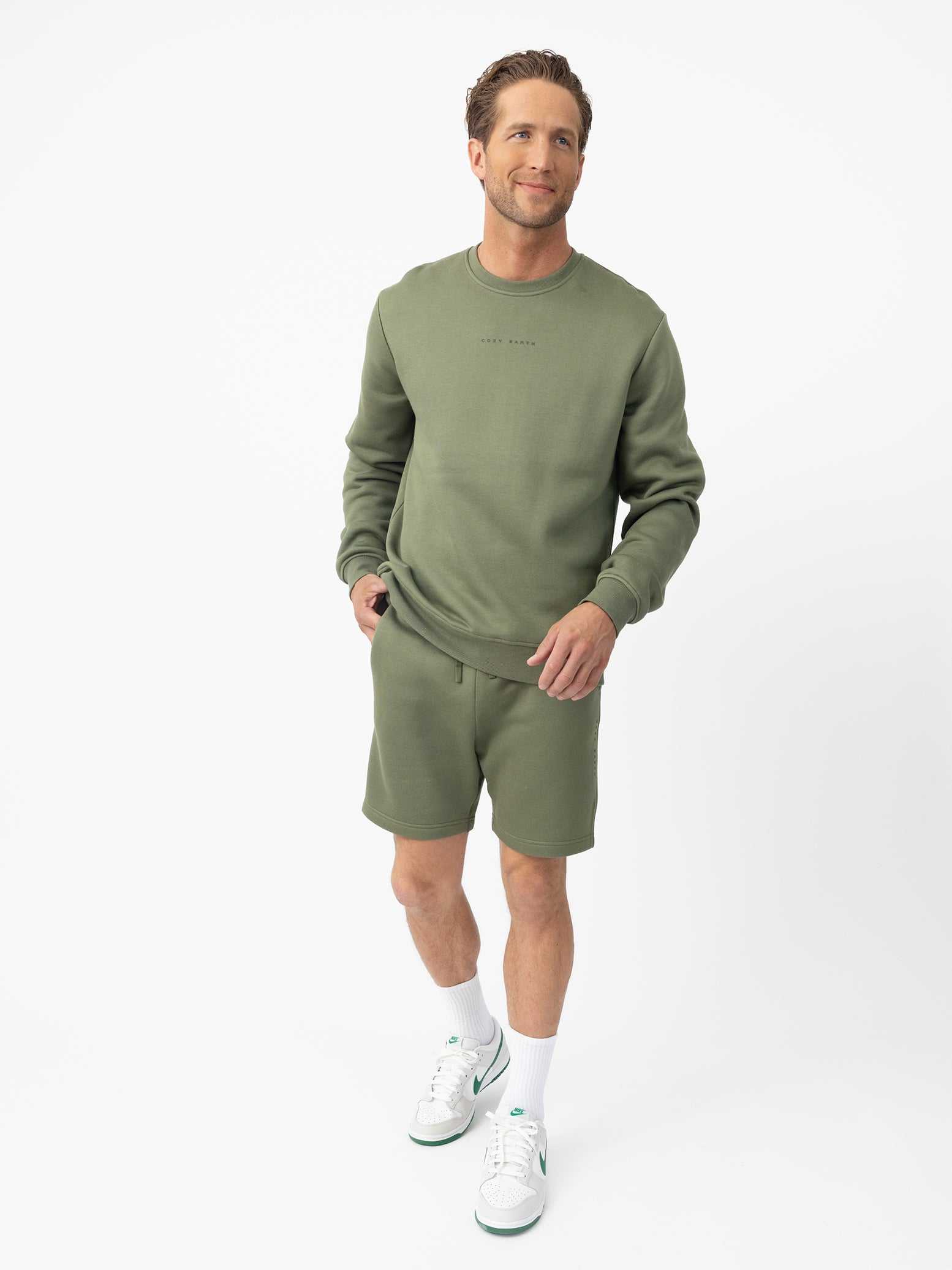 Man wearing Juniper cityscape crewneck with white background |Color:Juniper