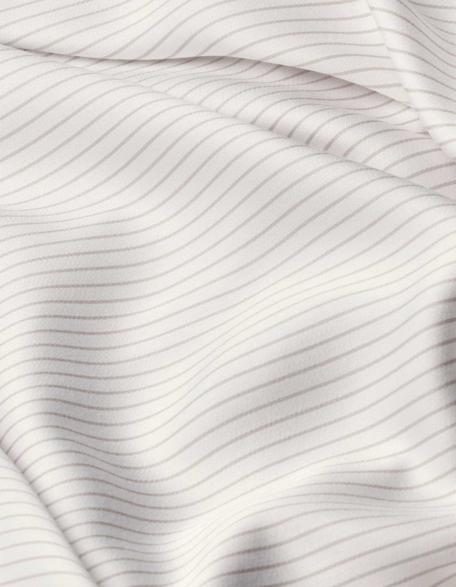 Close-up of Cozy Earth Bamboo Sheet Set’s white fabric with thin, evenly spaced light gray horizontal stripes, featuring soft folds and a smooth texture.|Color:Driftwood Pinstripe