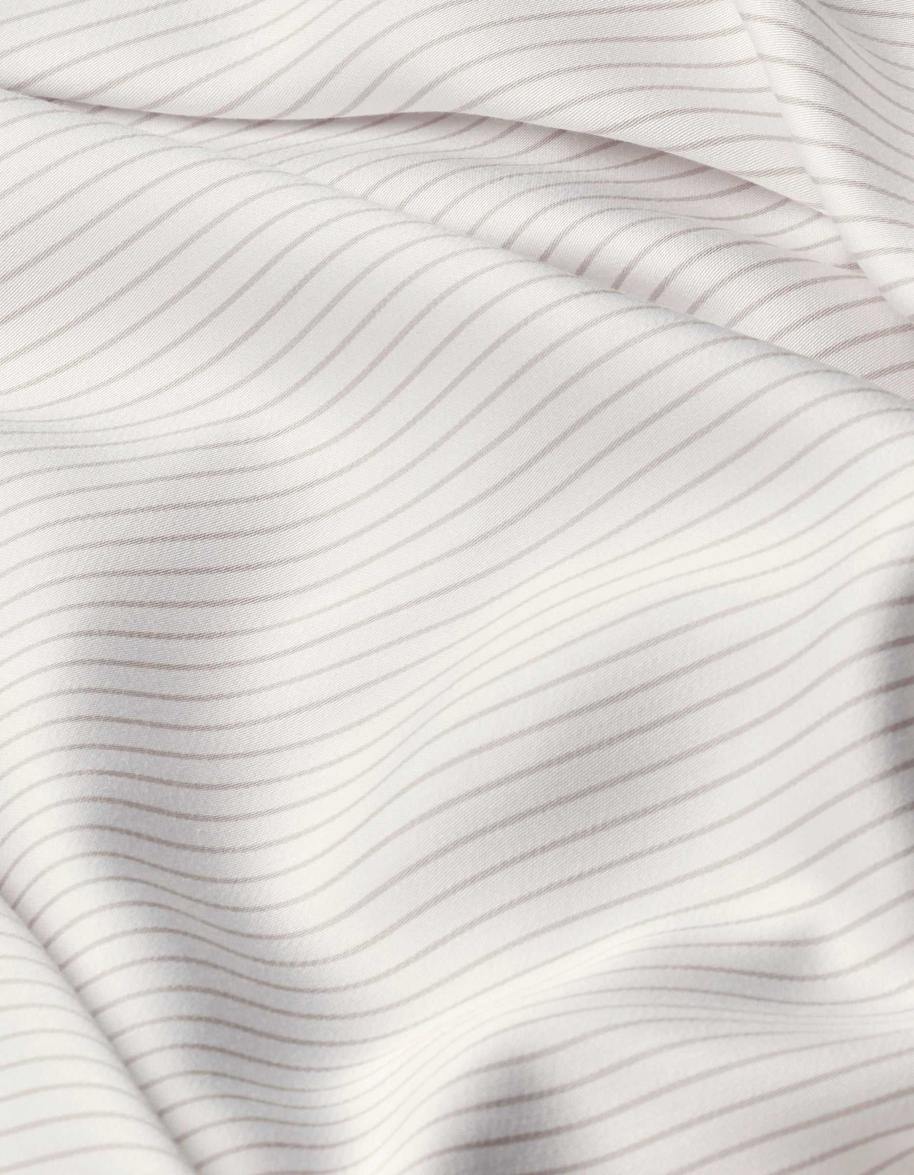 Close-up of Cozy Earth Bamboo Sheet Set’s white fabric with thin, evenly spaced light gray horizontal stripes, featuring soft folds and a smooth texture.|Color:Driftwood Pinstripe