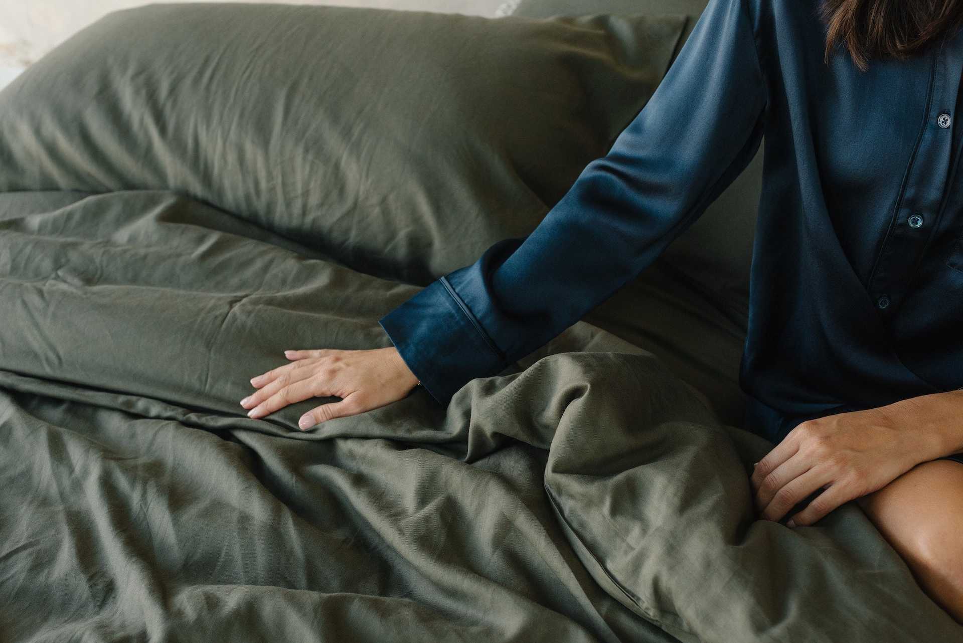 Olive Duvet Cover and comforter resting on a bed. |Color: Olive