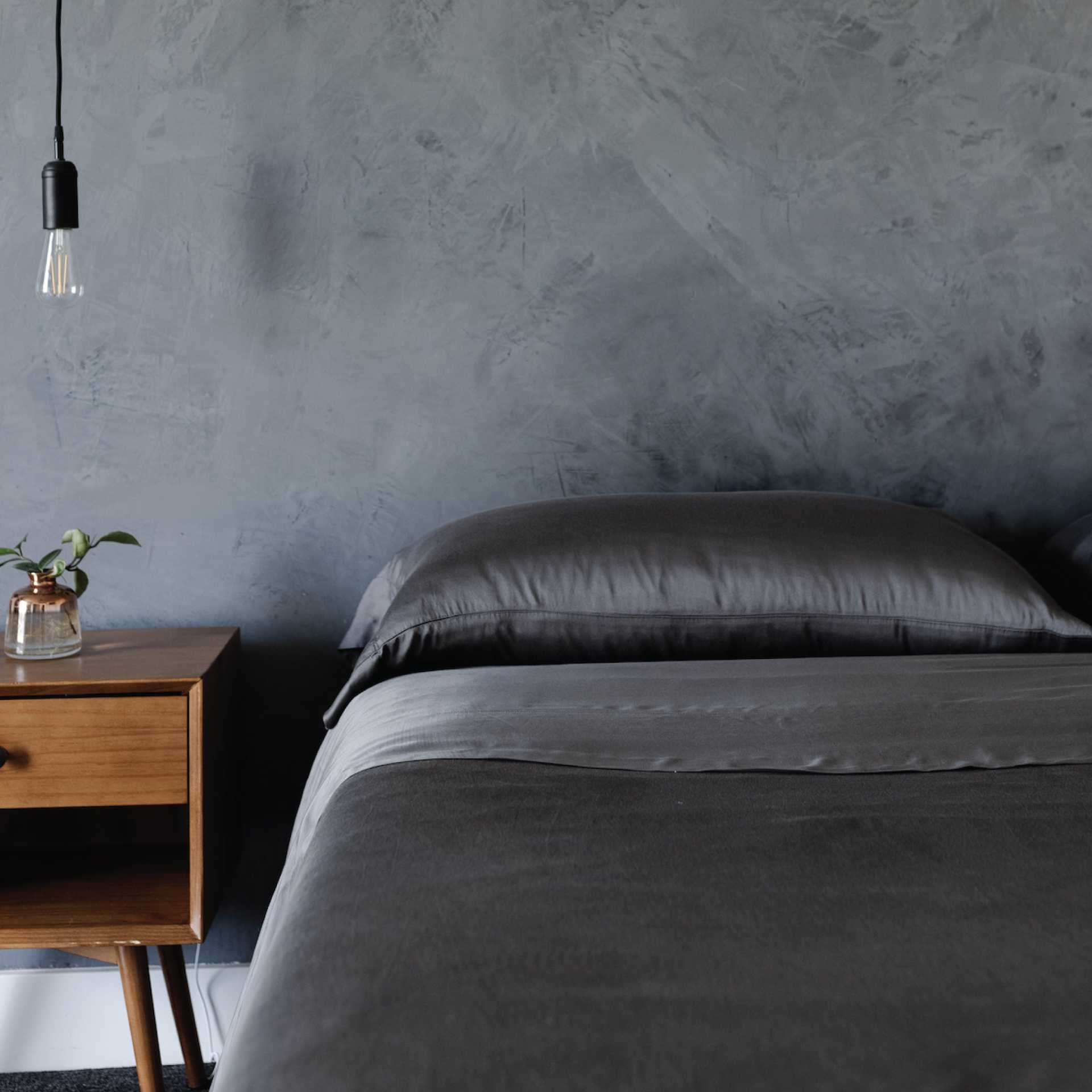 Dark bedroom with a bed with charcoal bedding |Color:Charcoal