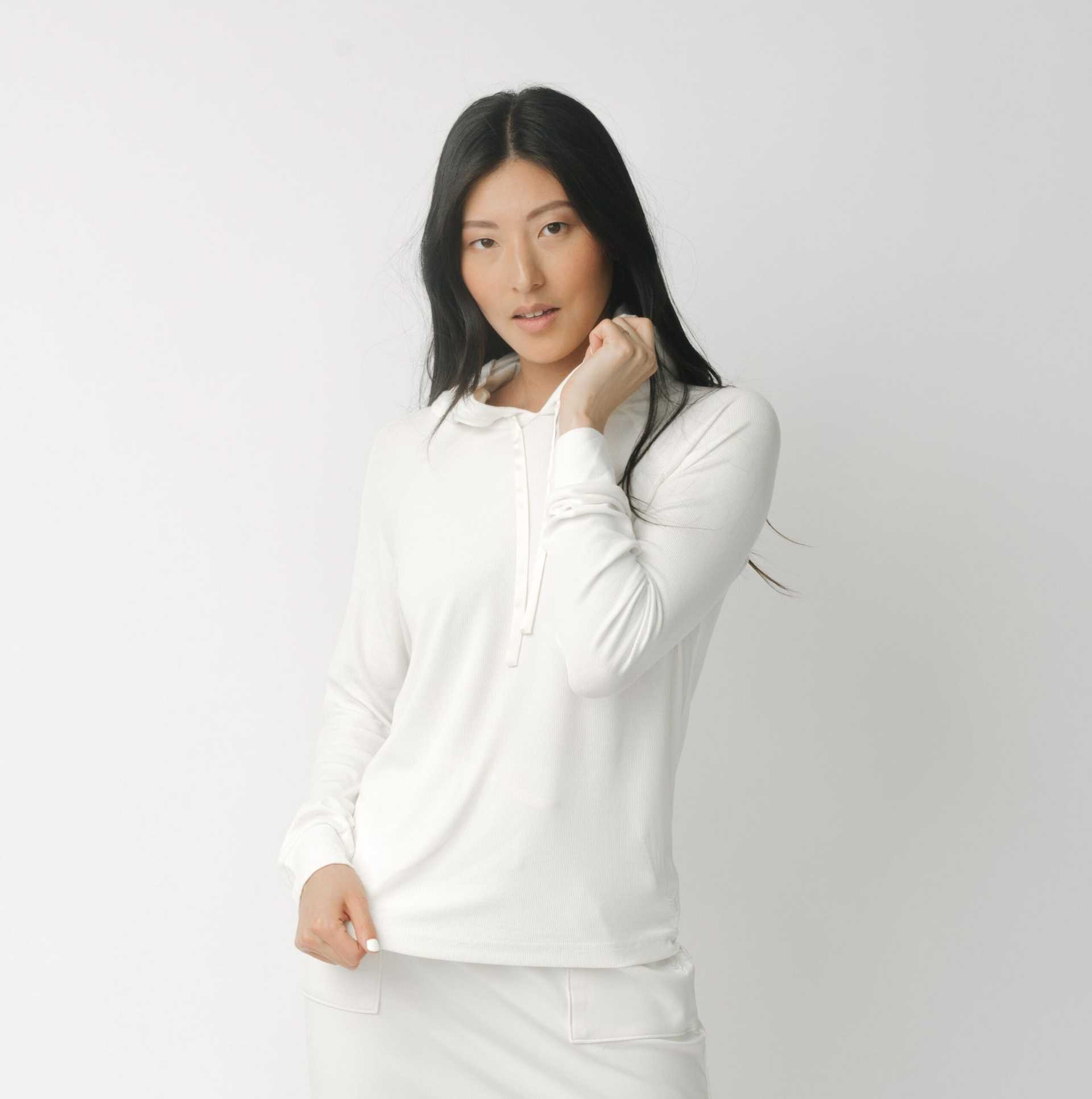 A woman wearing a white Cozy Earth Brushed Bamboo Hoodie against a plain background |Color:Ivory