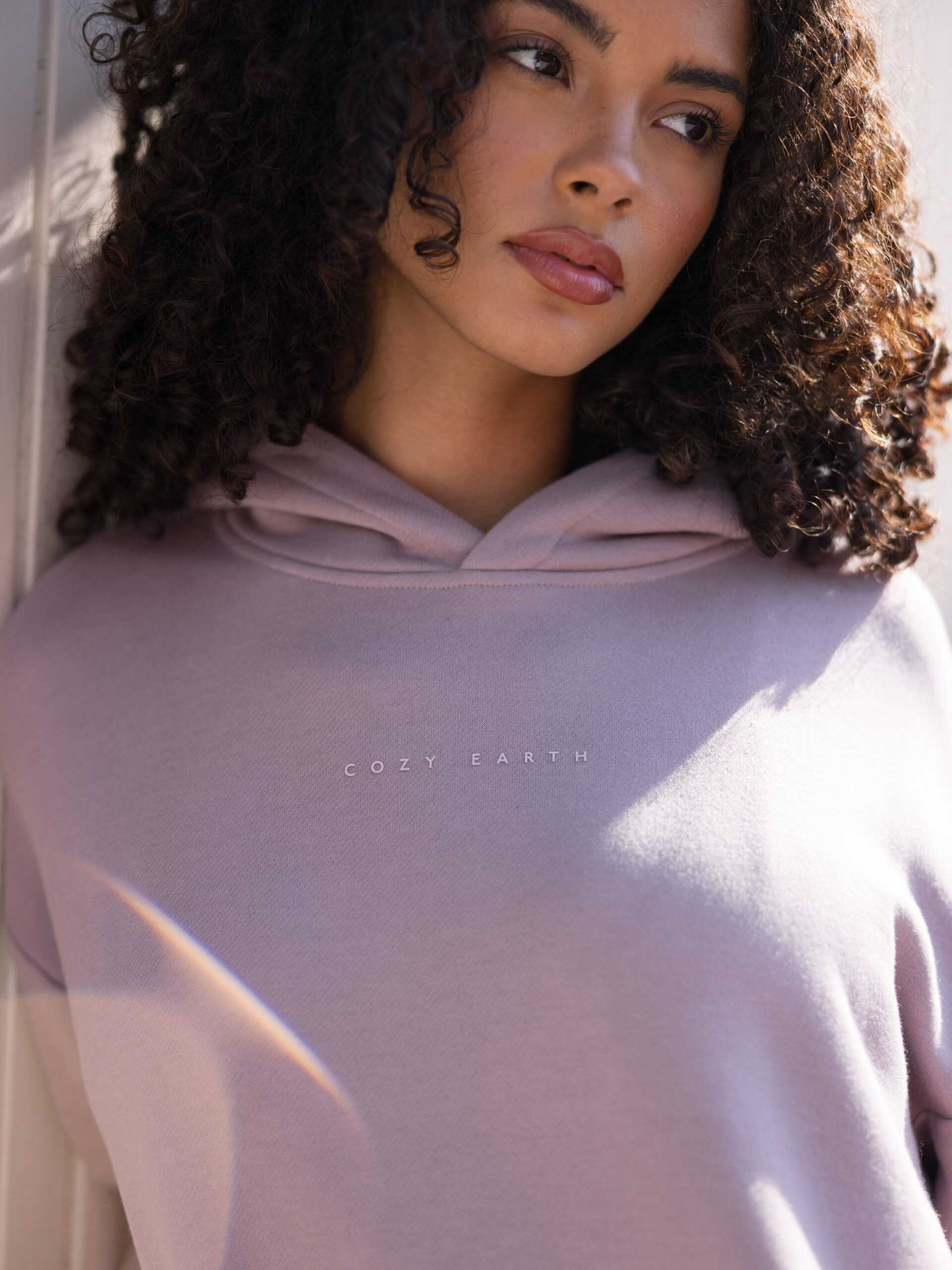 Close up of woman wearing dusty orchid cityscape hoodie |Color:Dusty Orchid