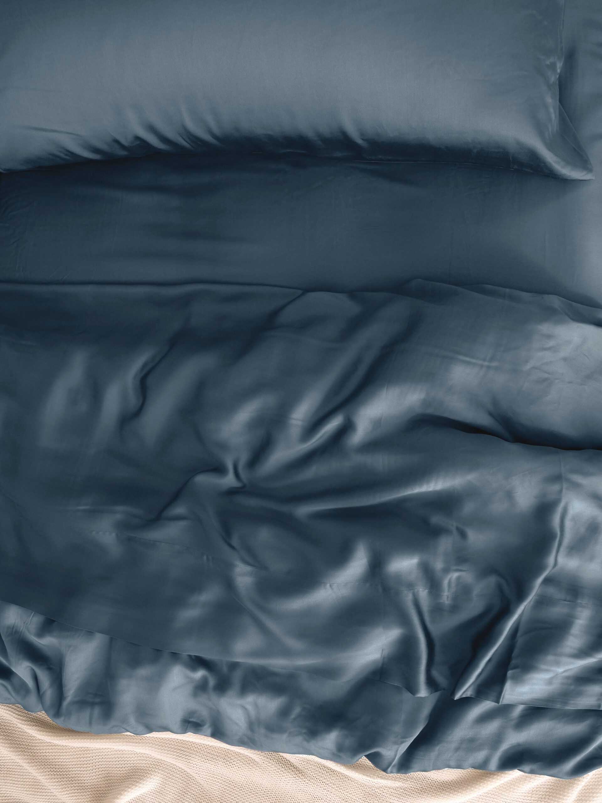 Close up of bed with pacific blue bedding |Color:Pacific Blue