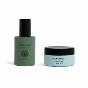 The Hydration Duo by Cozy Earth: a green-bottled hydrating serum with black pump and a light blue water cream jar with black lid, both displayed on a white background.