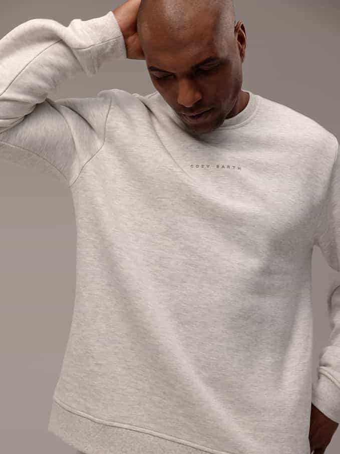 Man wearing heather grey cityscape crewneck with gray background |Color:Heather Grey