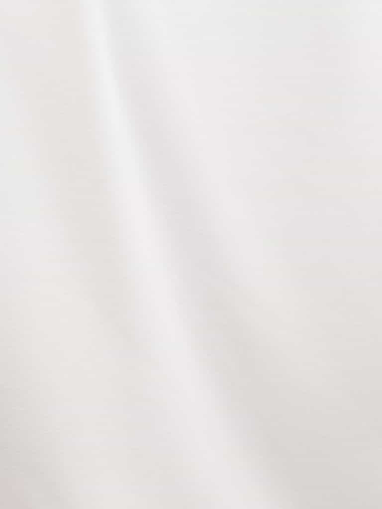 Ivory Bamboo Jogger Set. The photo was taken close up, showing off the print of the pajamas. |Color: Ivory