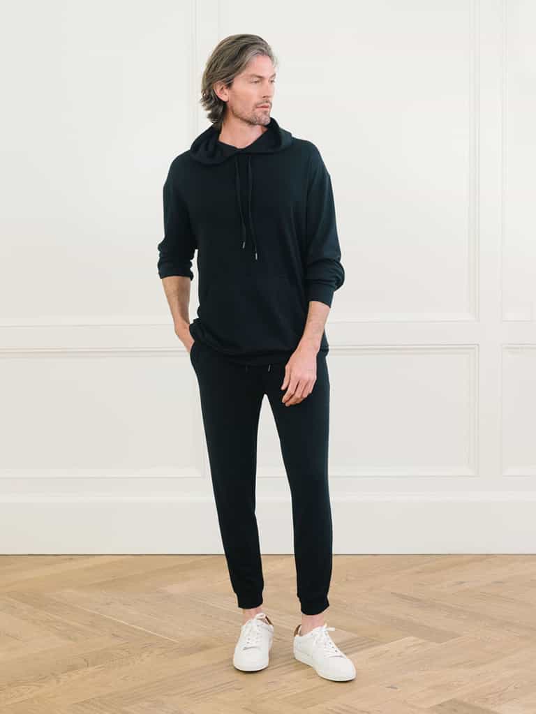 A man wears Men's Brushed Bamboo Hoodie & Jogger Set in Black. |Color:Black
