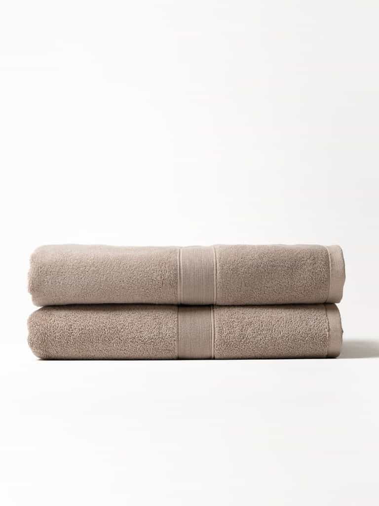Two luxe bath sheets folded with white background |Color:Sand