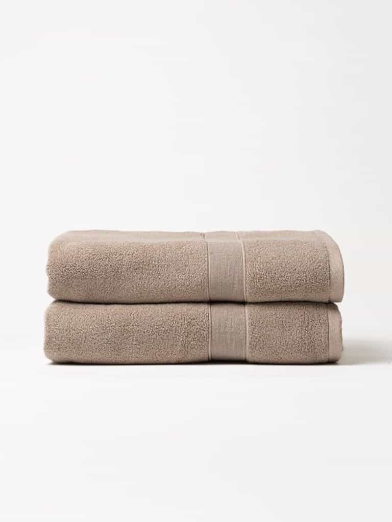 Sand luxe bath towels folded with white background |Color:Sand