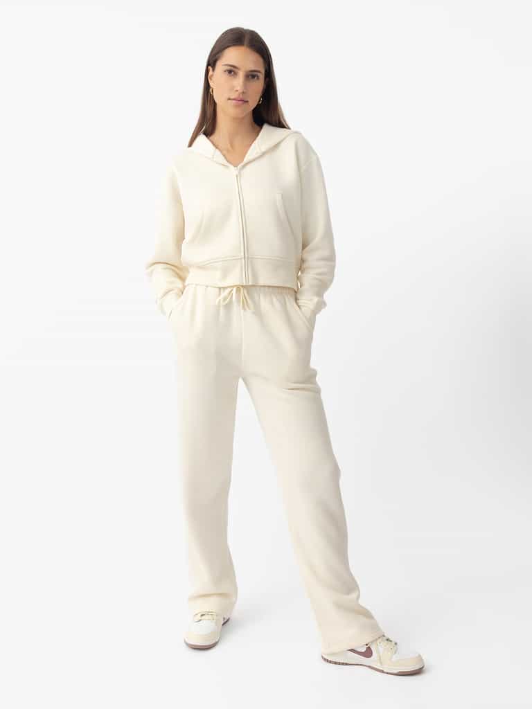 Woman wearing Alabaster CityScape Wide Leg Pant with white background |Color: Alabaster