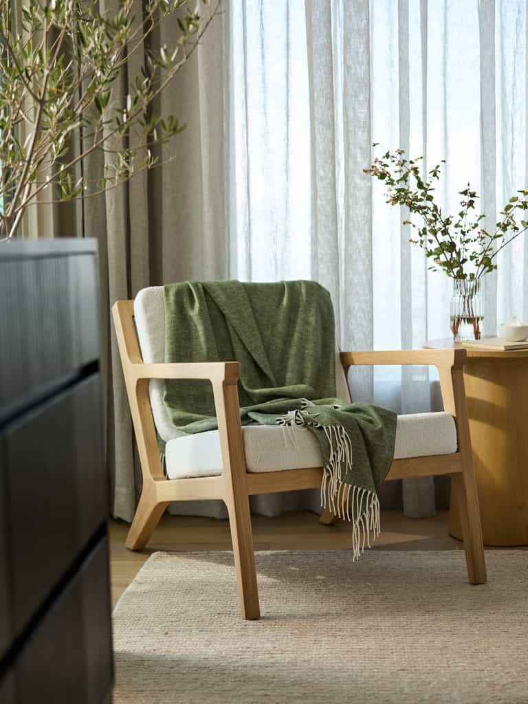 Ivy herringbone tassel throw draped over accent chair |Color:Ivy