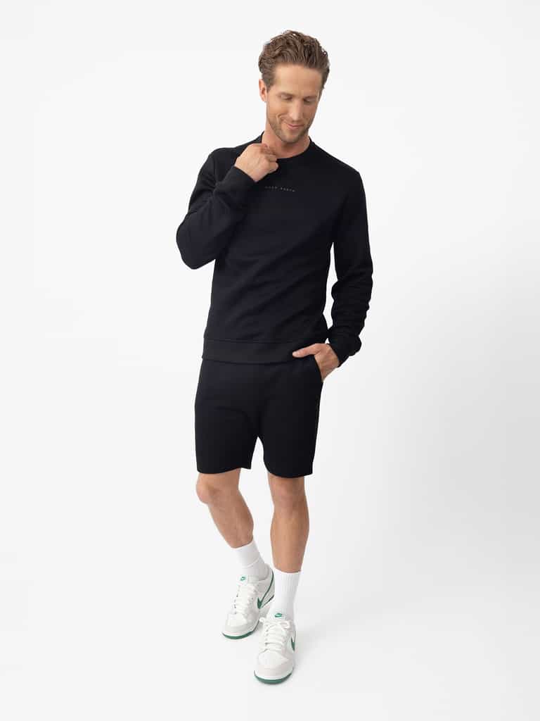 Man wearing black cityscape pullover and shorts with white background |Color:Black
