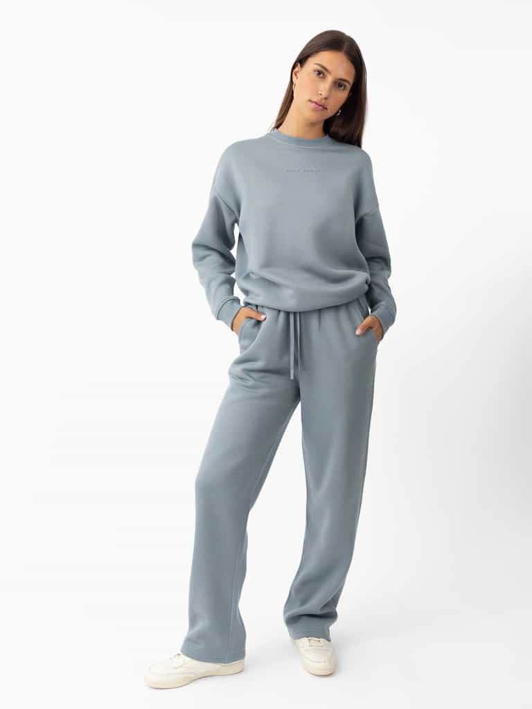 Woman wearing Smokey Blue CityScape Crewneck with white background |Color: Smokey Blue