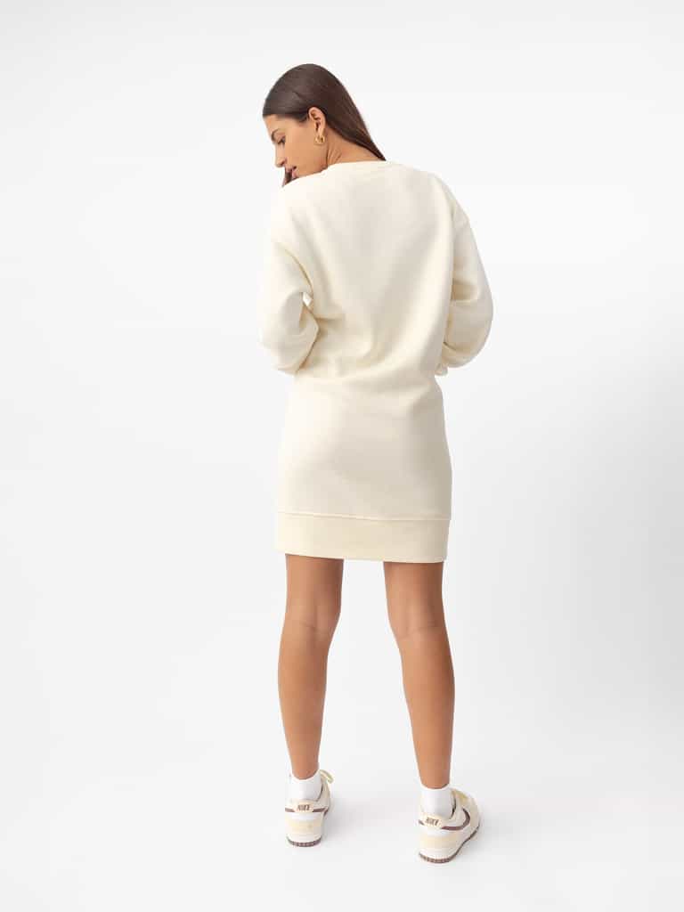 Woman wearing Alabaster CityScape Crewneck Dress with white background |Color:Alabaster