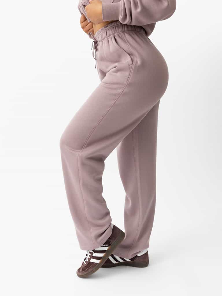 Woman wearing Dusty Orchid CityScape Wide Leg Pant with white background |Color: Dusty Orchid