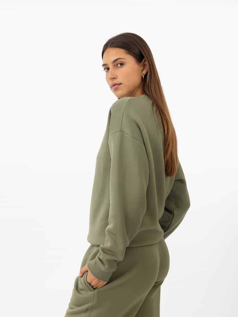 Woman wearing Juniper CityScape Crewneck with white background |Color: Juniper