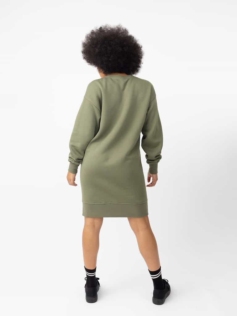 Woman wearing Juniper CityScape Crewneck Dress with white background |Color:Juniper