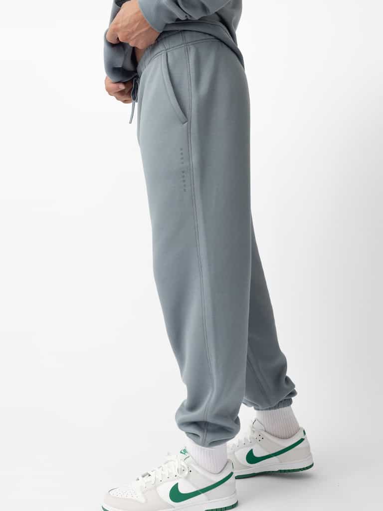 Man wearing smokey blue cityscape sweats with white background |Color:Smokey Blue