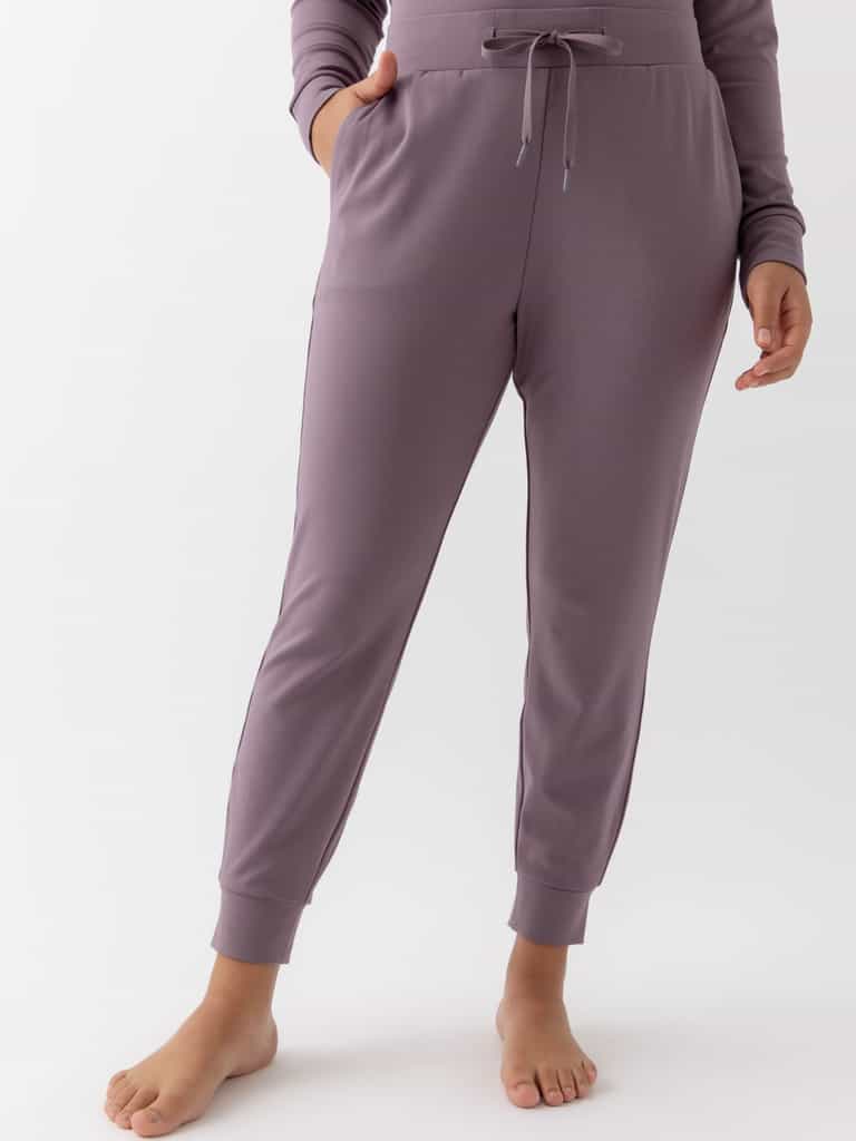 Twilight Bamboo Jogger Set modeled by a woman. The photo was taken in a high contrast setting, showing off the colors and lines of the pajamas. |Color: Twilight