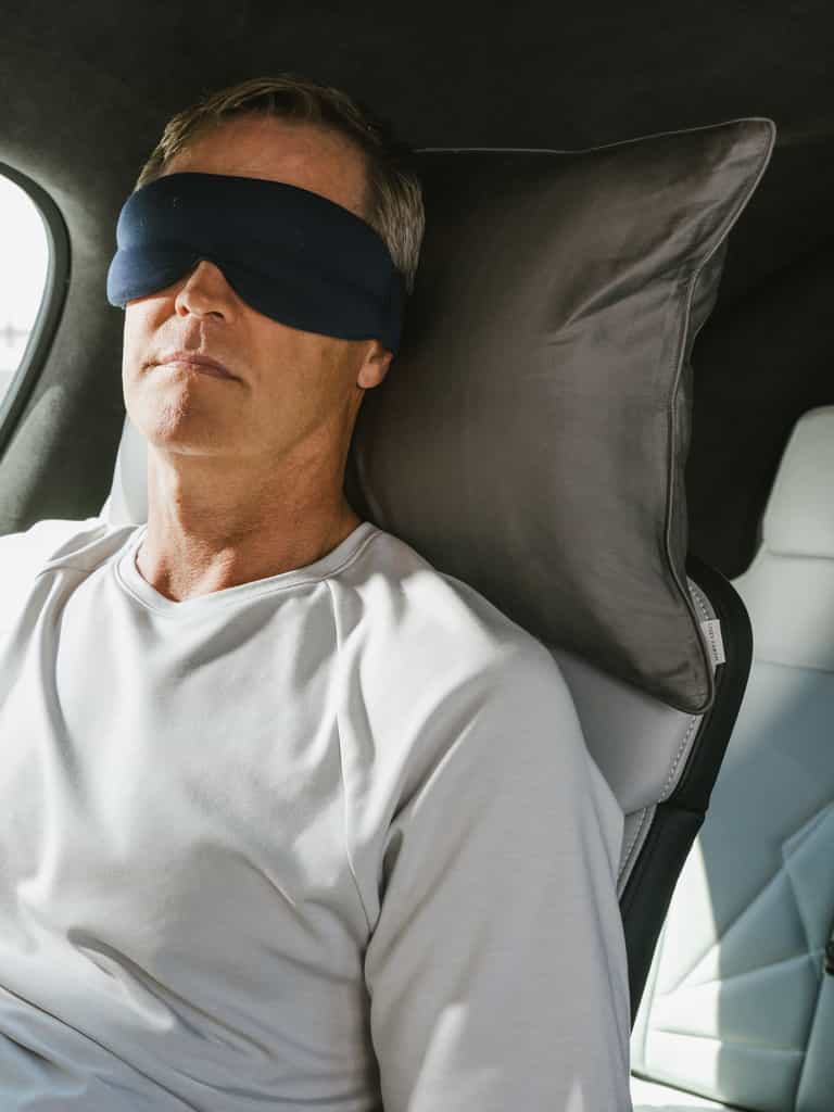 Man with face mask in airplane using travel pillow |Size:Travel