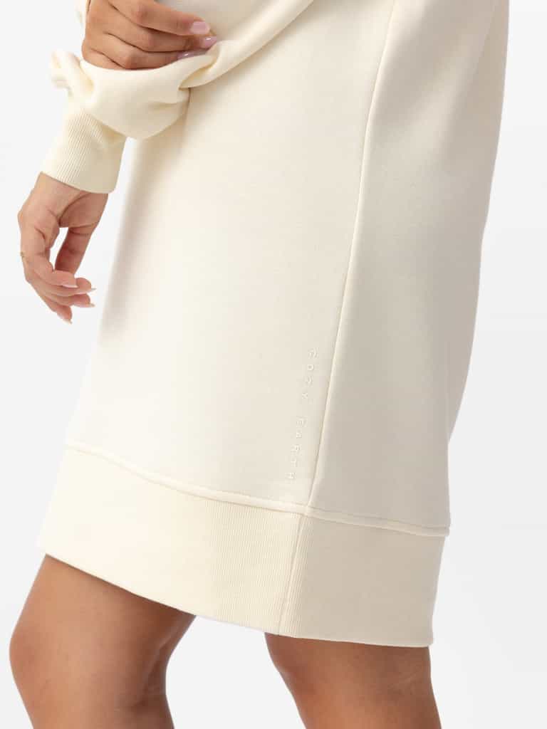 Woman wearing Alabaster CityScape Crewneck Dress with white background |Color:Alabaster