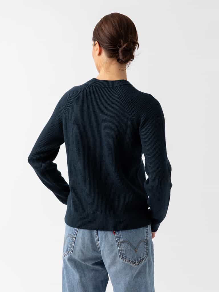 Back of woman wearing eclipse classic crewneck and jeans with white background |Color:Eclipse
