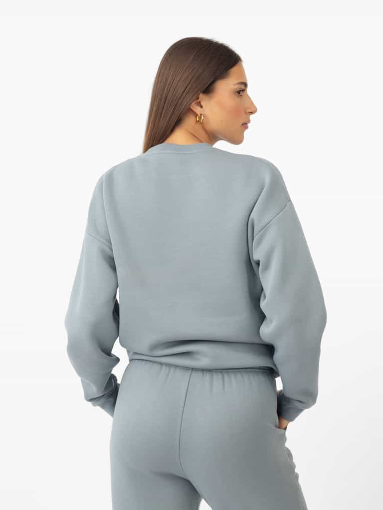 Woman wearing Smokey Blue CityScape Crewneck with white background |Color: Smokey Blue