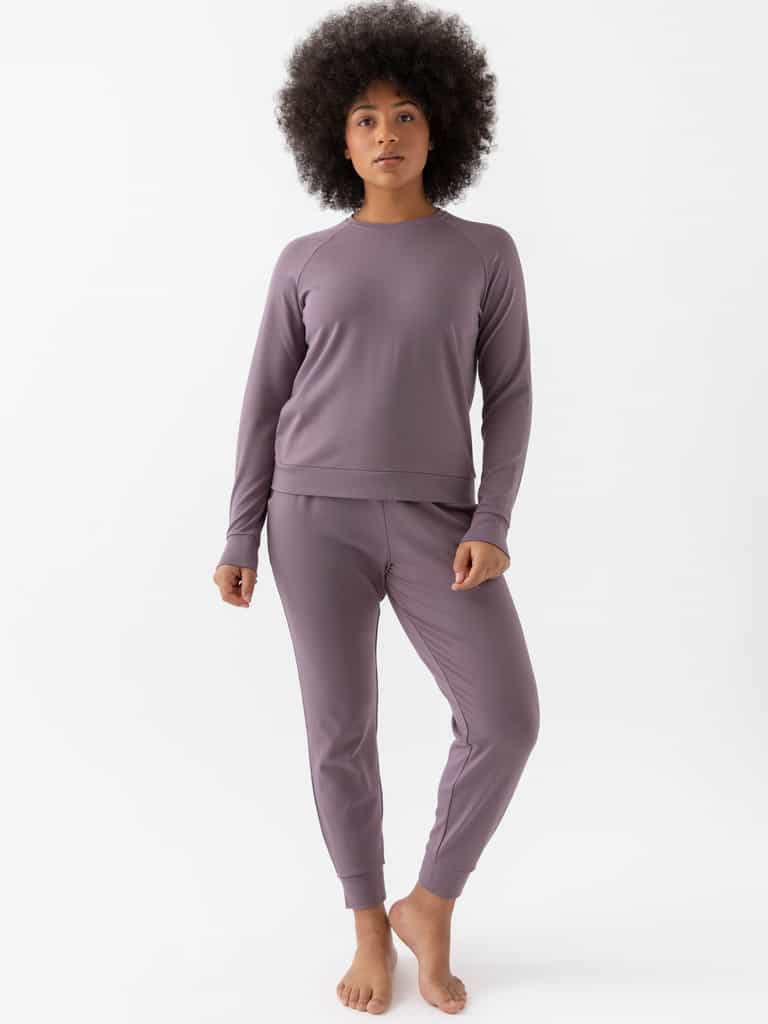 Twilight Bamboo Jogger Set modeled by a woman. The photo was taken in a high contrast setting, showing off the colors and lines of the pajamas. |Color: Twilight