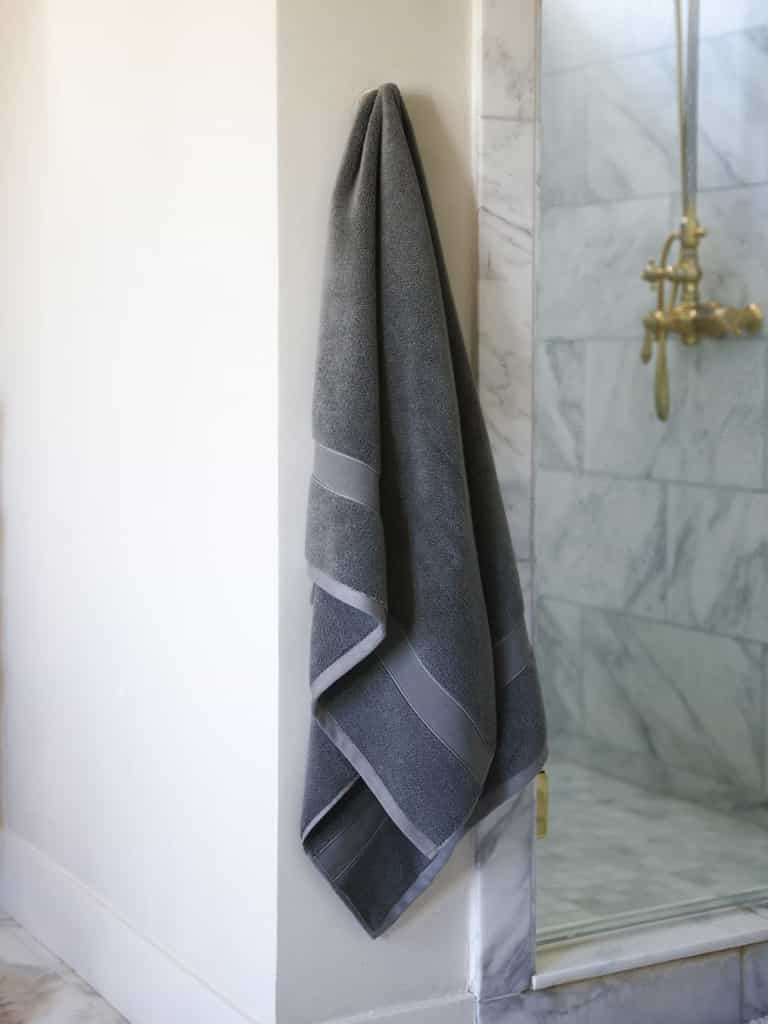 Charcoal luxe bath towel hanging next to shower |Color:Charcoal