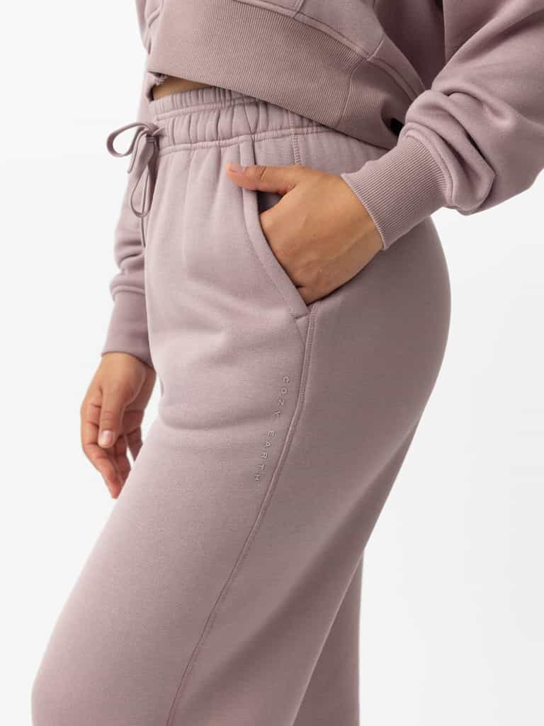 Woman wearing Dusty Orchid CityScape Wide Leg Pant with white background |Color: Dusty Orchid