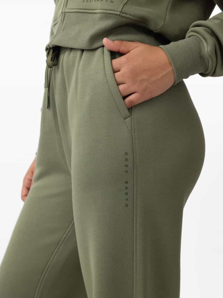 Woman wearing Juniper CityScape Wide Leg Pant with white background |Color: Juniper