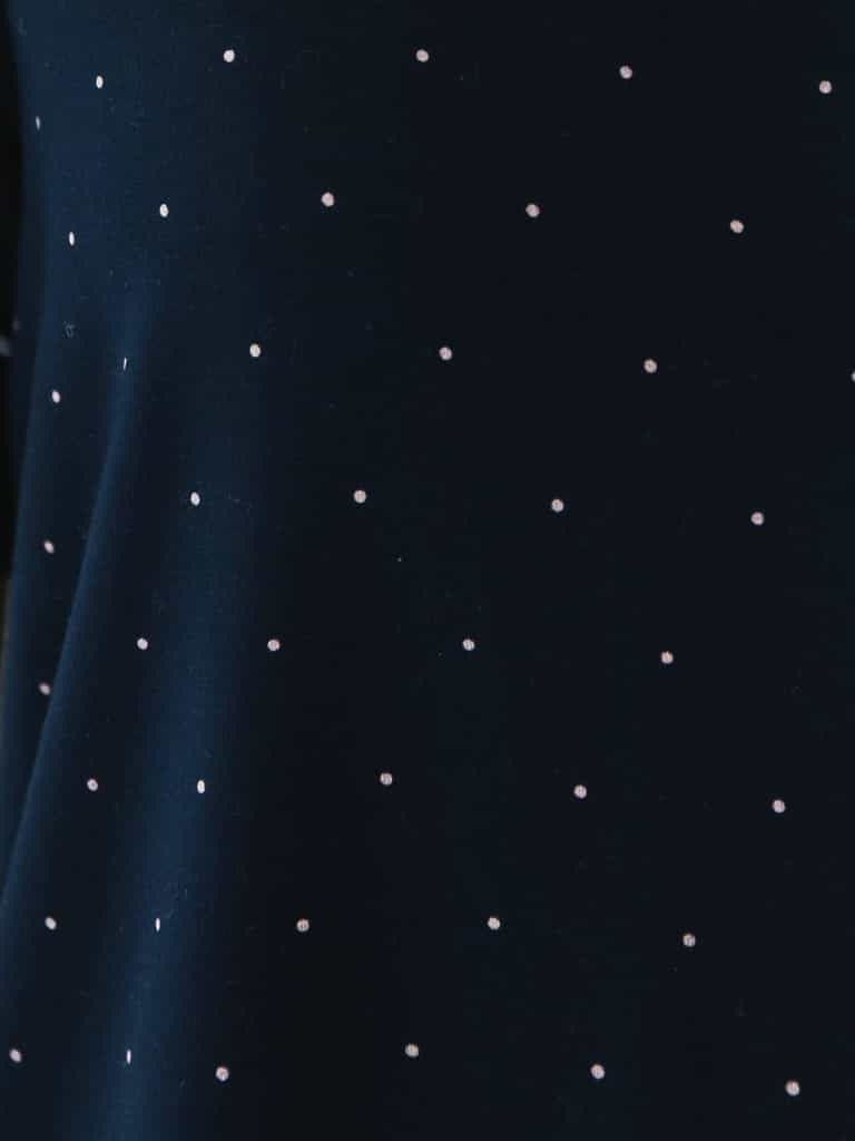 Mini Dot Sleeve & Pant Bamboo Pajama Set. The photo was taken close up, showing off the print of the pajamas. |Color: Mini Dot