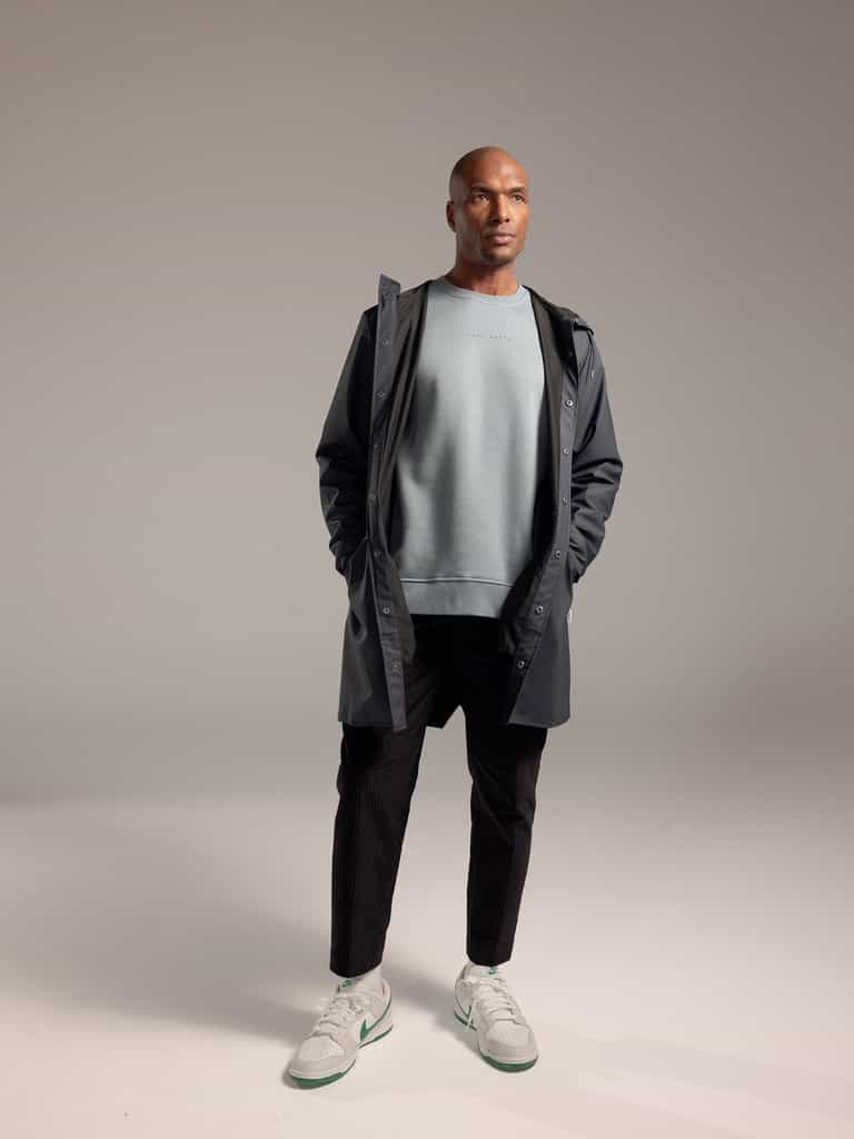 Man wearing Smokey Blue cityscape crewneck with grey background |Color:Smokey Blue