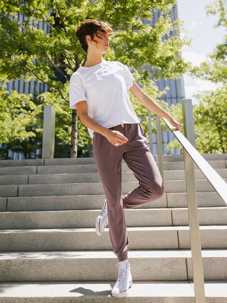 Twilight Studio Jogger. The Studio Joggers are worn by a woman photographed with a city type background. |Color:Twilight