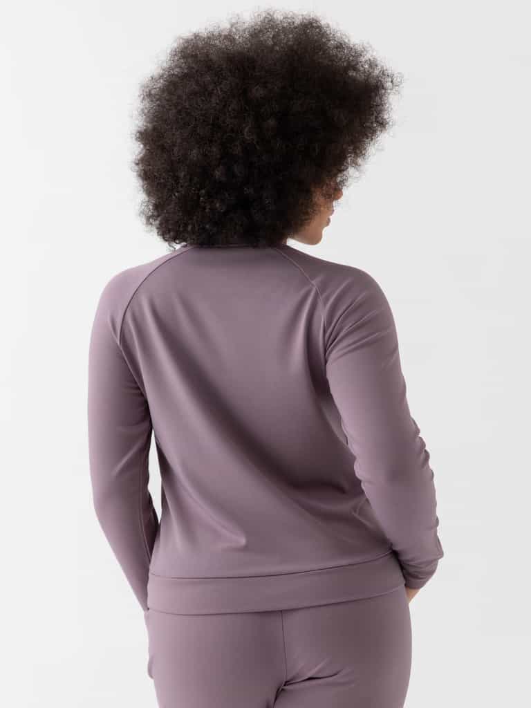 Twilight Bamboo Jogger Set modeled by a woman. The photo was taken in a high contrast setting, showing off the colors and lines of the pajamas. |Color: Twilight