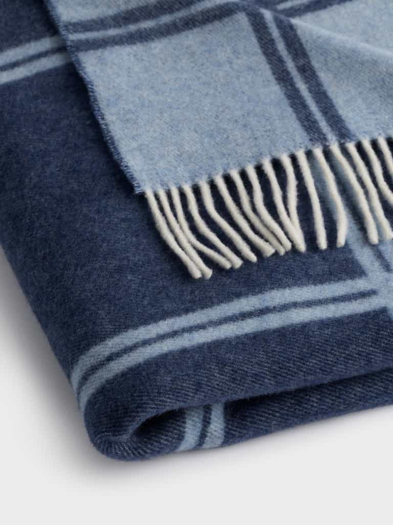 Close up of folded navy cortina throw |Color:Navy/Sky