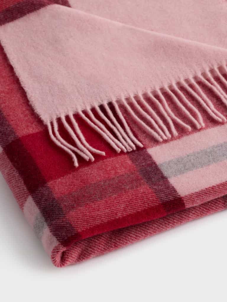 Close up of folded pink lucca throw |Color:Pink