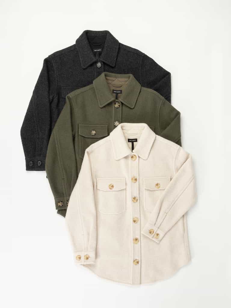 Three Women's Boucle Shackets by Cozy Earth are displayed on a white background. The jackets come in black, olive green, and beige, each featuring front pockets with button closures, long sleeves, and collars. They are layered on top of each other, giving a staggered appearance. |Color:Olive