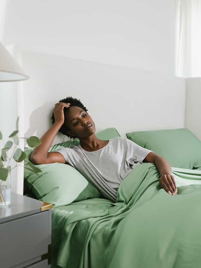 Women sitting on bed with fern colored bedding |Color:Fern