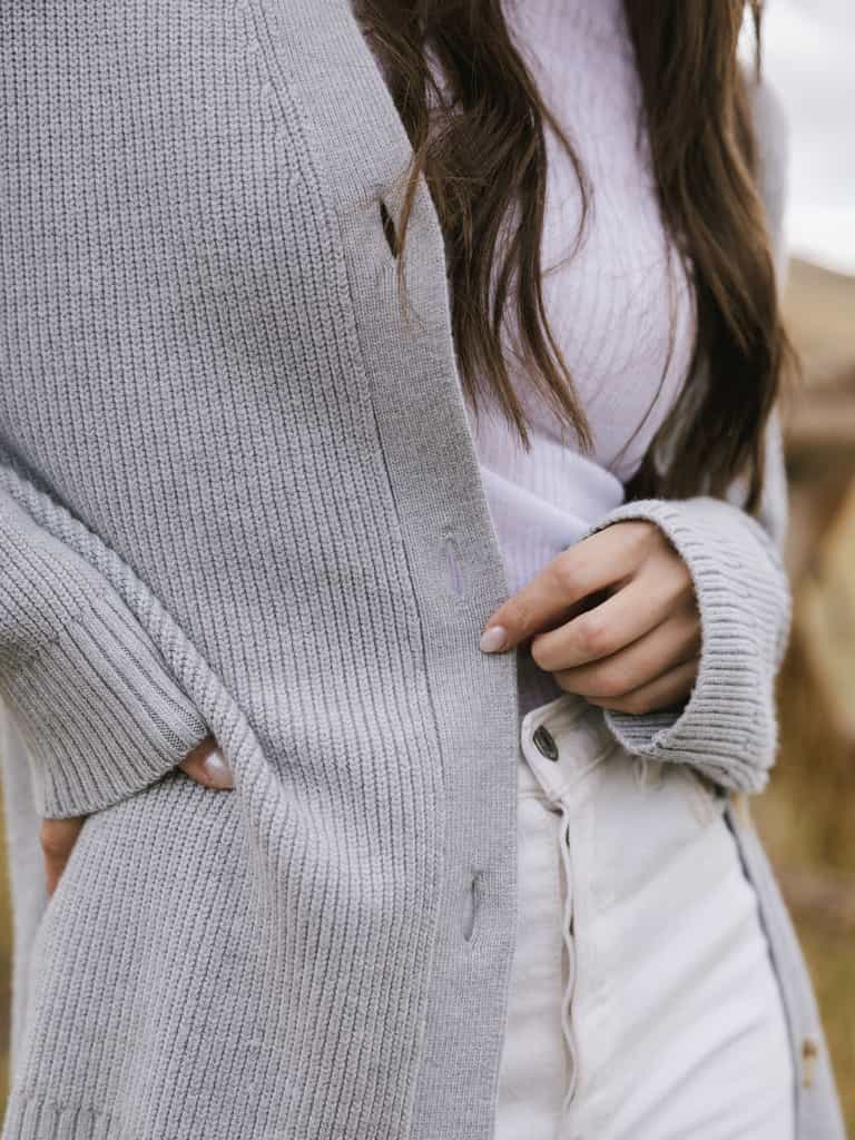A close-up of woman wearing Cozy Earth Classic Cardigan in grey |Color:Light Grey