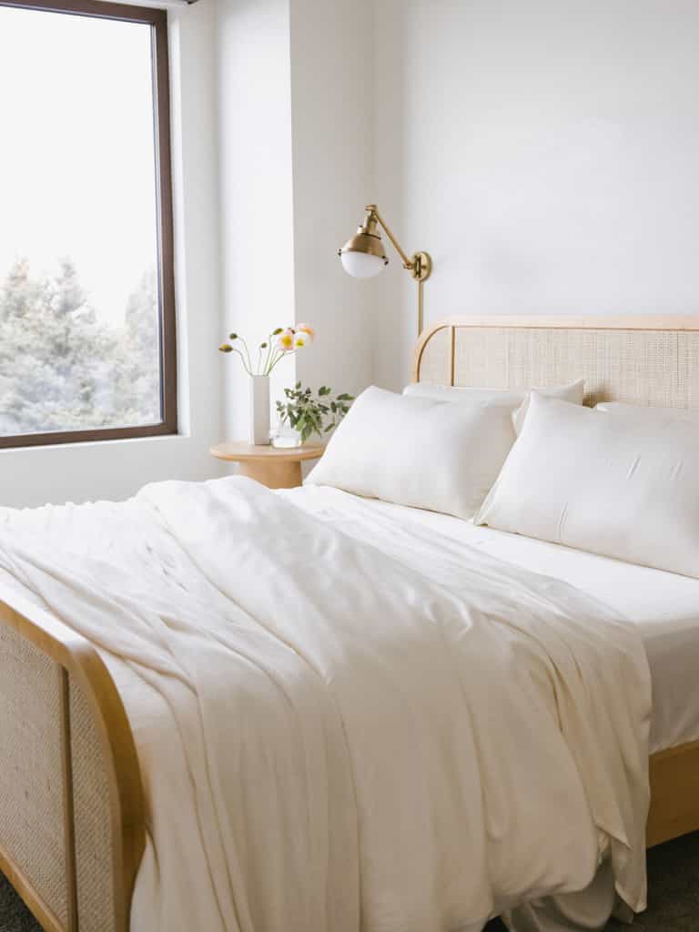 Zoomed out image of a whole bed with creme bedding |Color:Creme