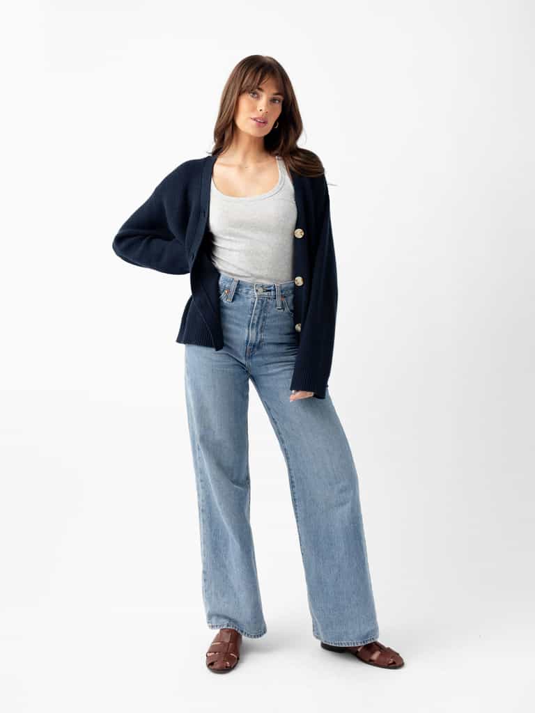 Woman standing with white background wearing jeans and eclipse cardigan |Color:Eclipse